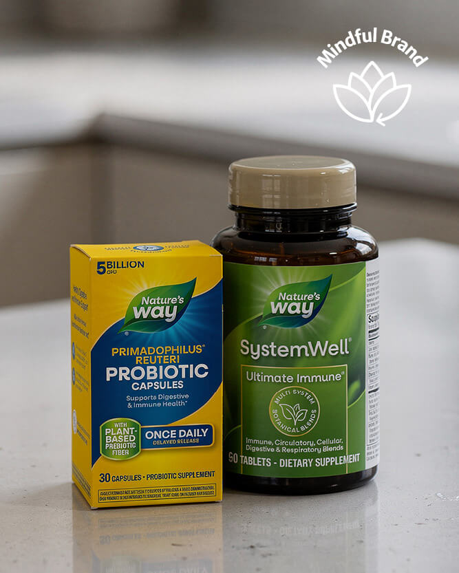 Nature's Way probiotic capsules and SystemWell supplement on a reflective surface with 'Mindful Brand' logo.