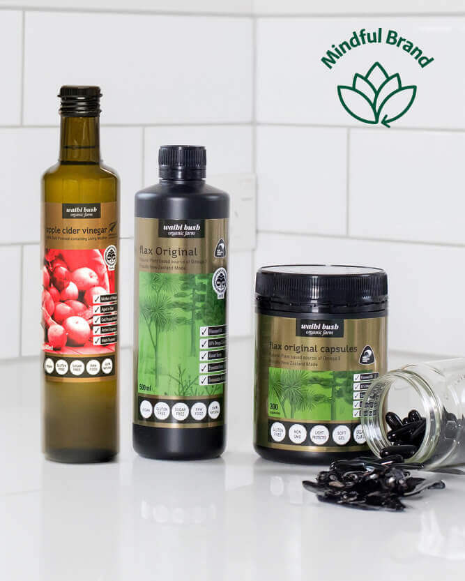 Collection of health products including bottles and a jar on a white surface with 'Mindful Brand' logo.