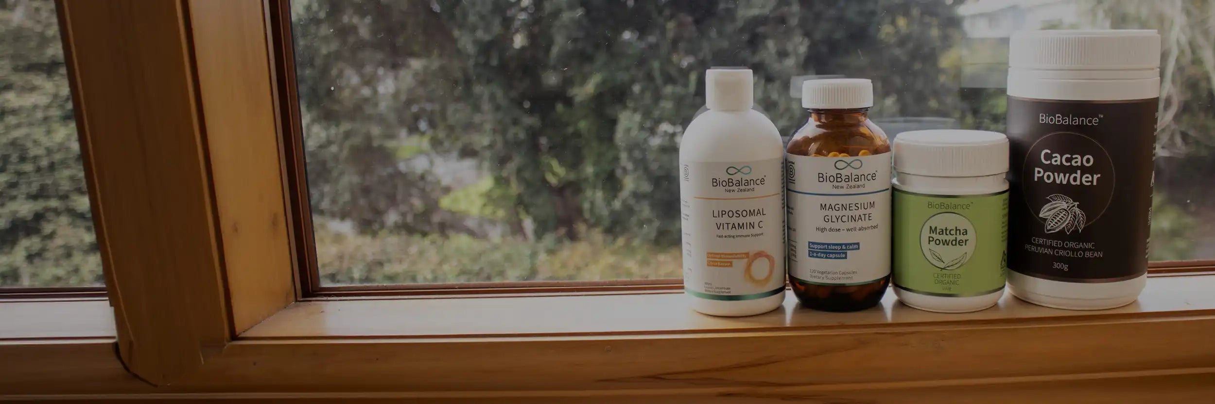 4 BioBalance products displayed on a window sill.