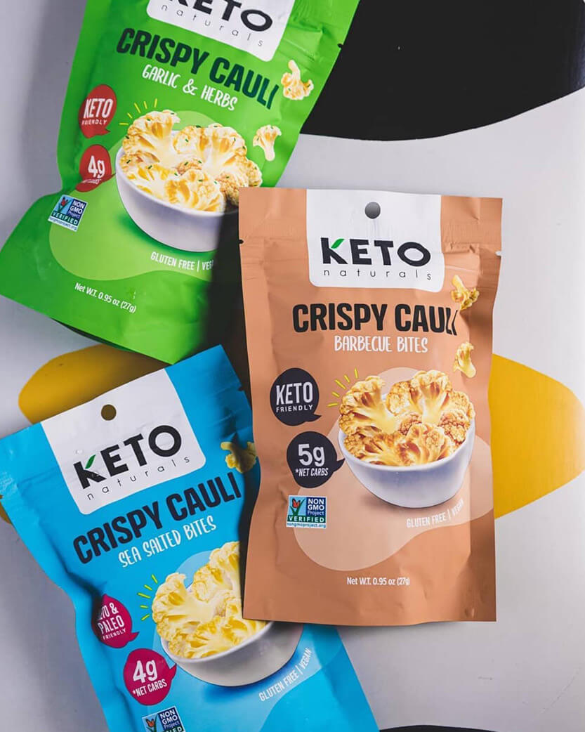 Three packages of Keto Naturals Crispy Cauliflower on a white background.