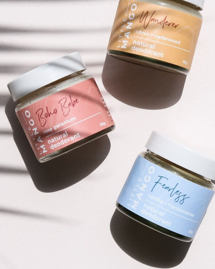 Three jars of Little Mango natural deodorant on a light background.