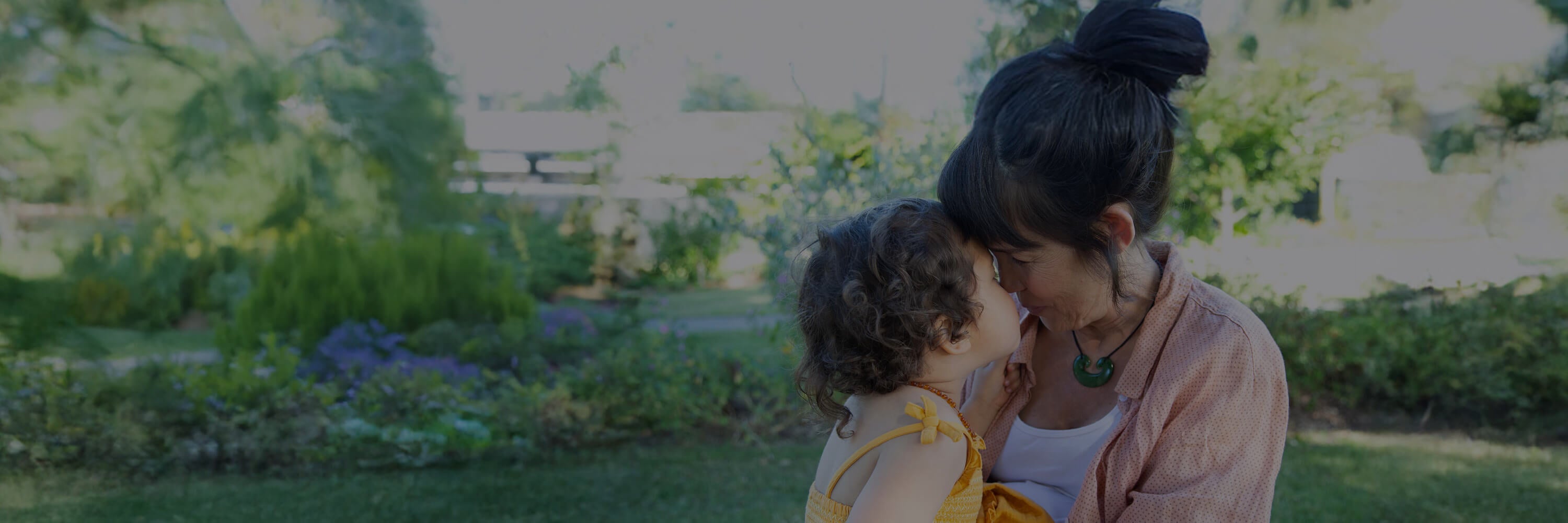 Woman and child in a natural setting.