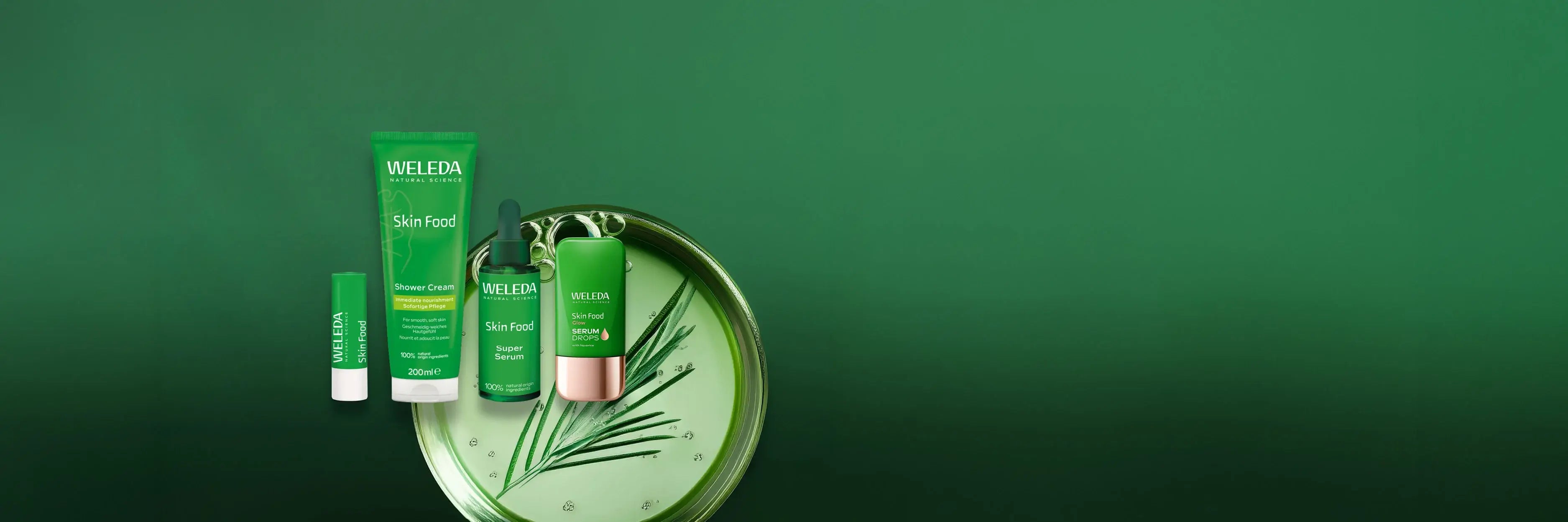 Weleda Skin Food range products on a plain green background.