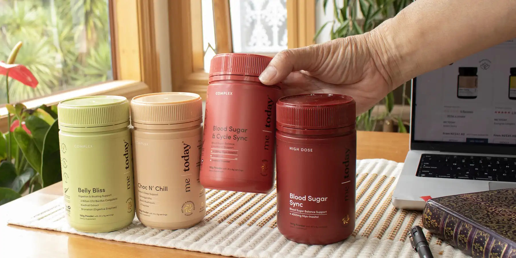 Selection of Me Today products displayed on a wooden surface.