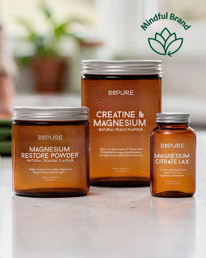 BePure Magnesium products lined up on a bench. Green mindful brand logo.