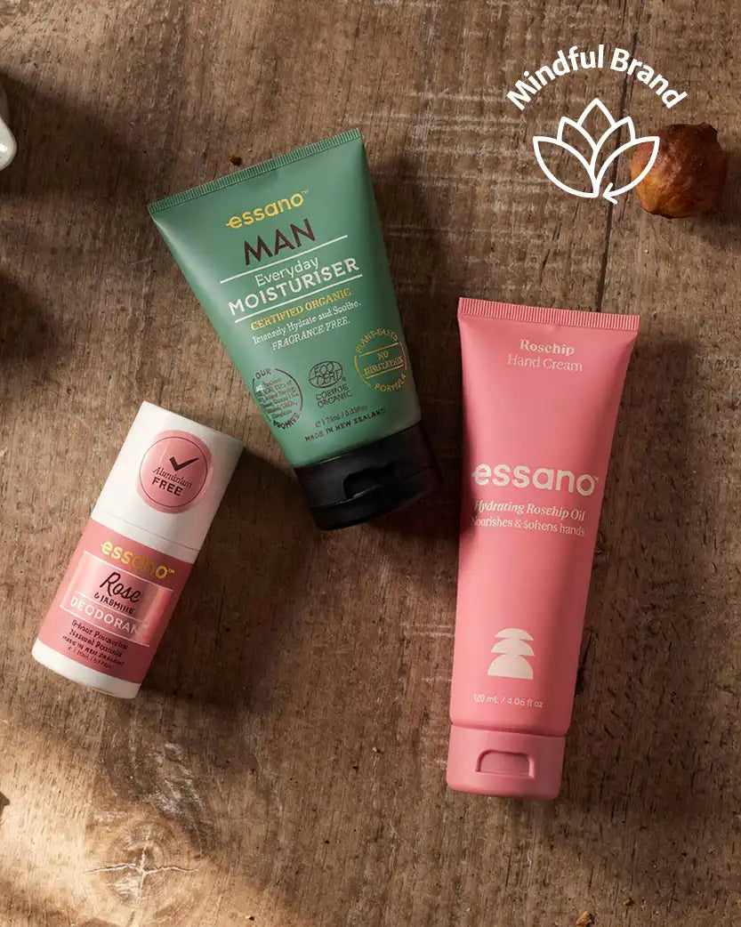 Three essana skincare products on a textured surface with 'Mindful Brand' logo.