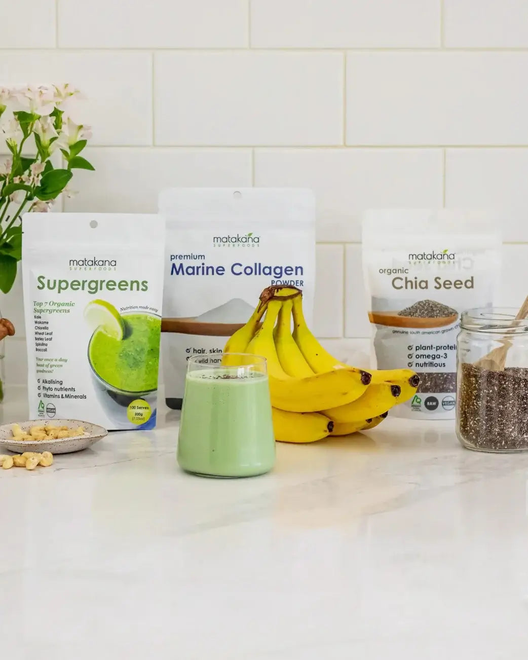 Supplement products including Supergreens, Marine Collagen, and Chia Seed on a kitchen counter.