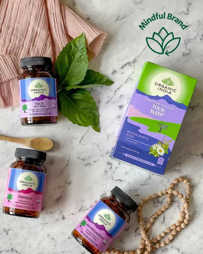 Organic India wellness products on a marble surface with 'Mindful Brand' logo.