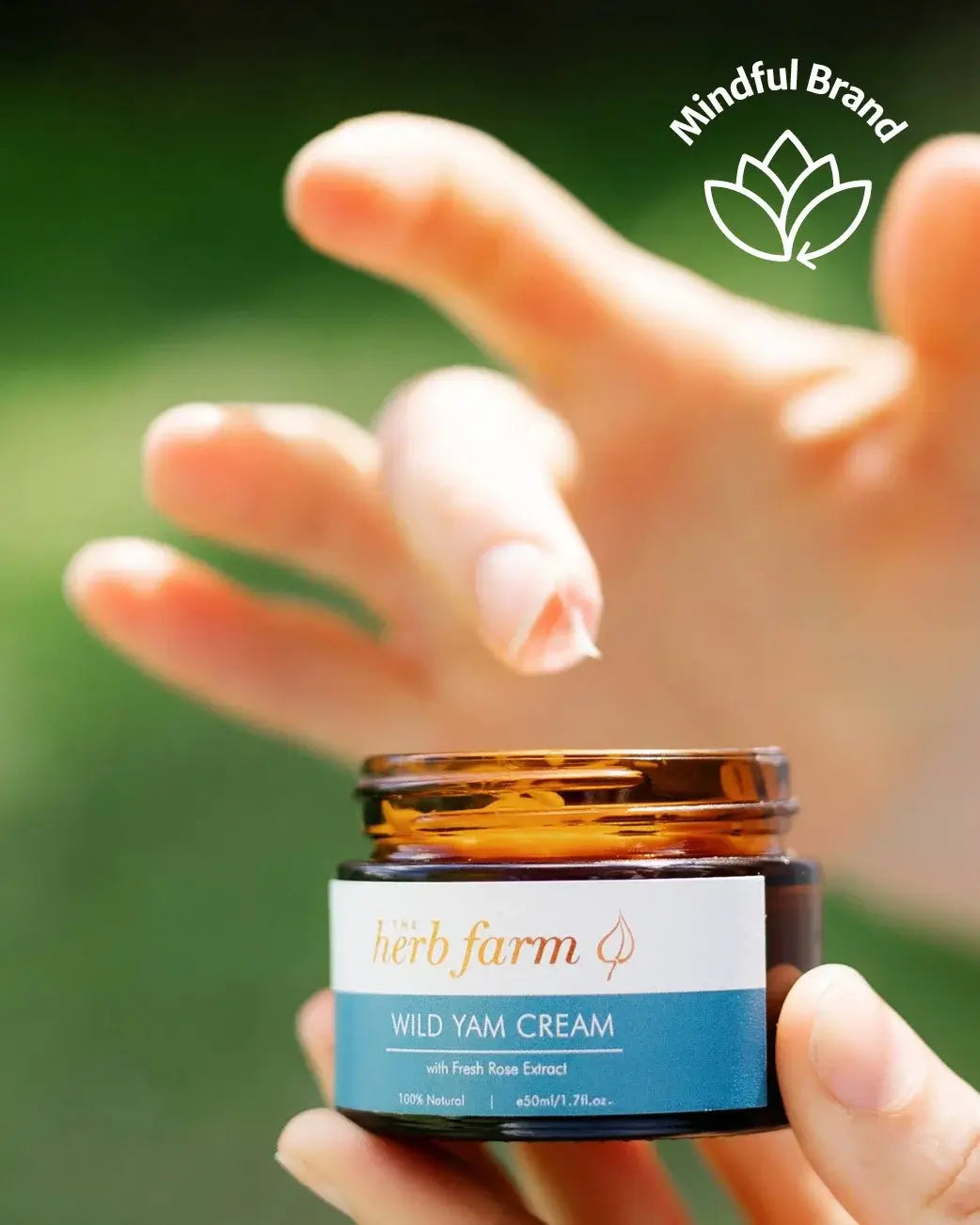 Jar of Wild Yam Cream held by a hand with 'Mindful Brand' logo above.