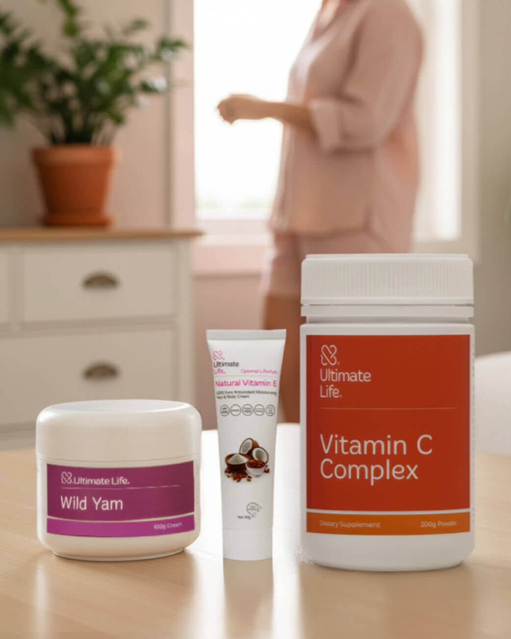 Supplement products including 'Wild Yam' and 'Vitamin C Complex' from Ultimate Life on a table with a blurred background.