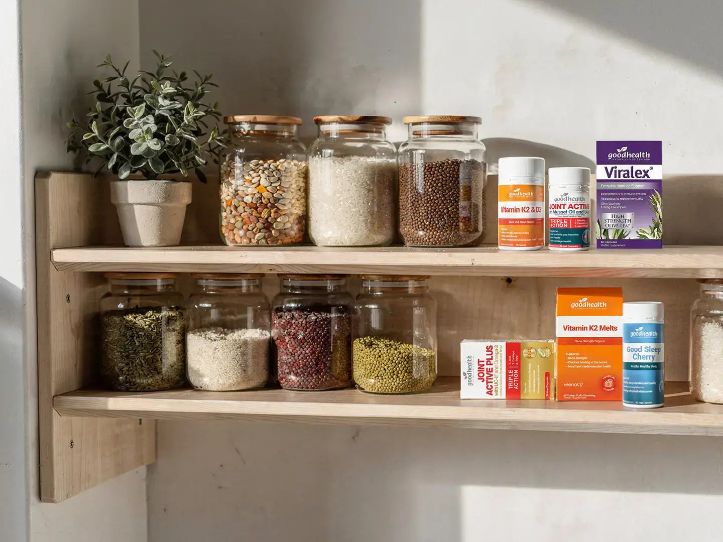 Good Health supplement products on a shelf of jars and plants.