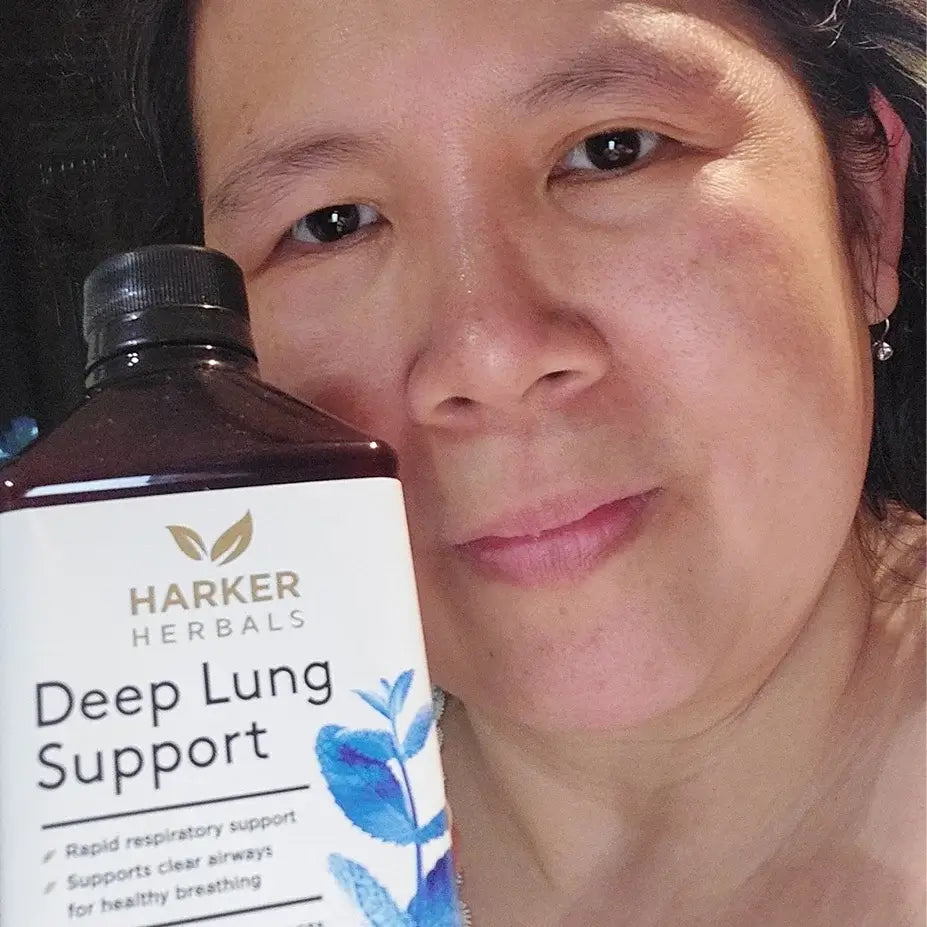 Woman with Harker Herbals Deep Lung Support next to her.