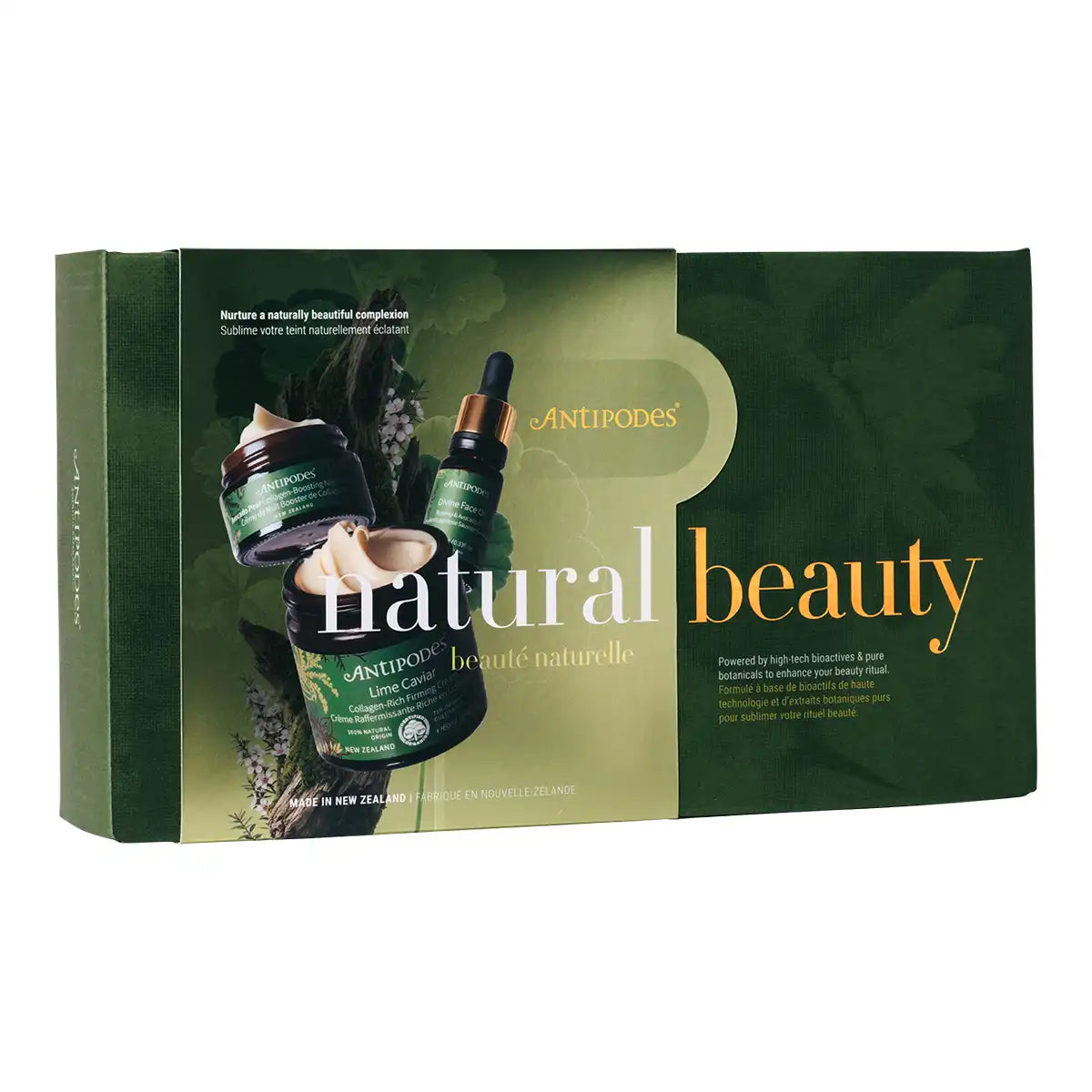 A rectangular cosmetic gift box shown on a plain white background. The box is dark green with botanical imagery and displays an illustration of a green cream jar and a dropper bottle.