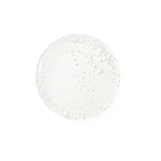 White circular object with water droplets on a white background