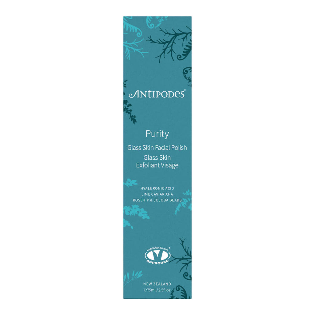 A tall, narrow teal-blue product box for Antipodes Purity Glass Skin Facial Polish, featuring white text and decorative botanical illustrations.