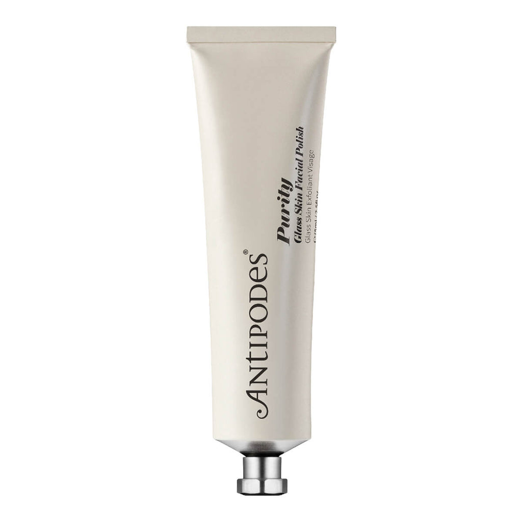 Tube of Purity Glass Skin Facial Polish on a solid white background. The tube is a cream color with a metallic silver cap, featuring black text.