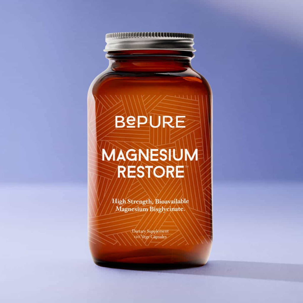 BePure Magnesium Restore supplement bottle on a gradient blue background