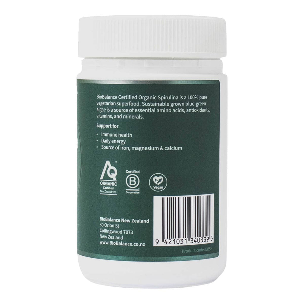Container of Biobalance Certified Organic Spirulina with green label and white cap on a white background. Support for immune health, daily energy, source of iron, magnesium & calcium.