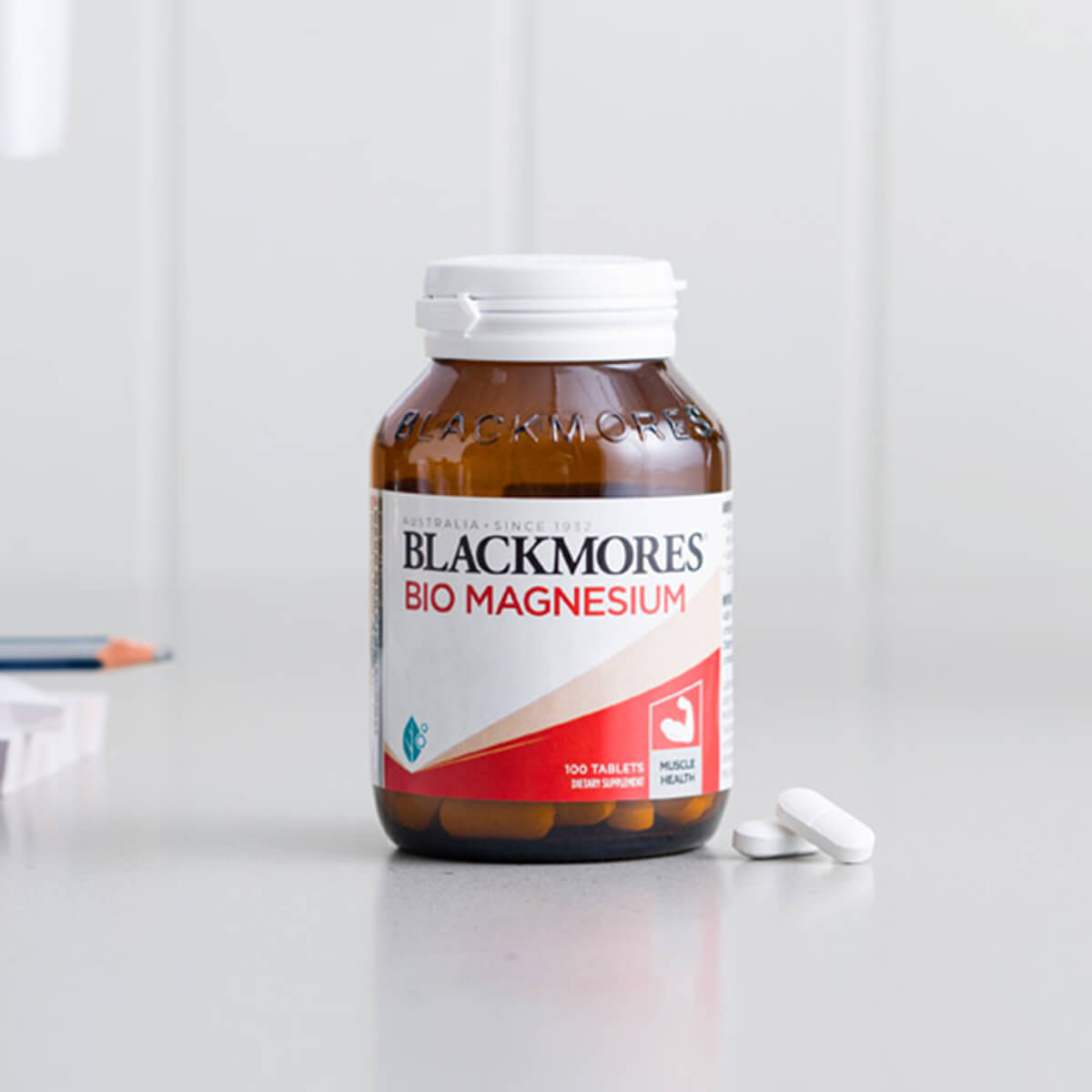 Blackmores Bio Magnesium supplement bottle on a white surface with a white background.