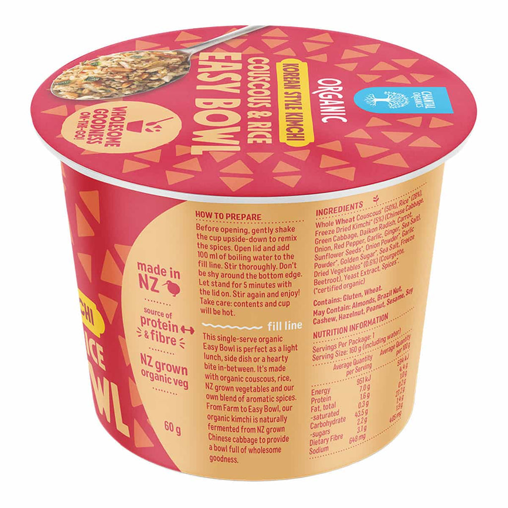 Cup of food with a pink lid and yellow body, featuring text and branding.
