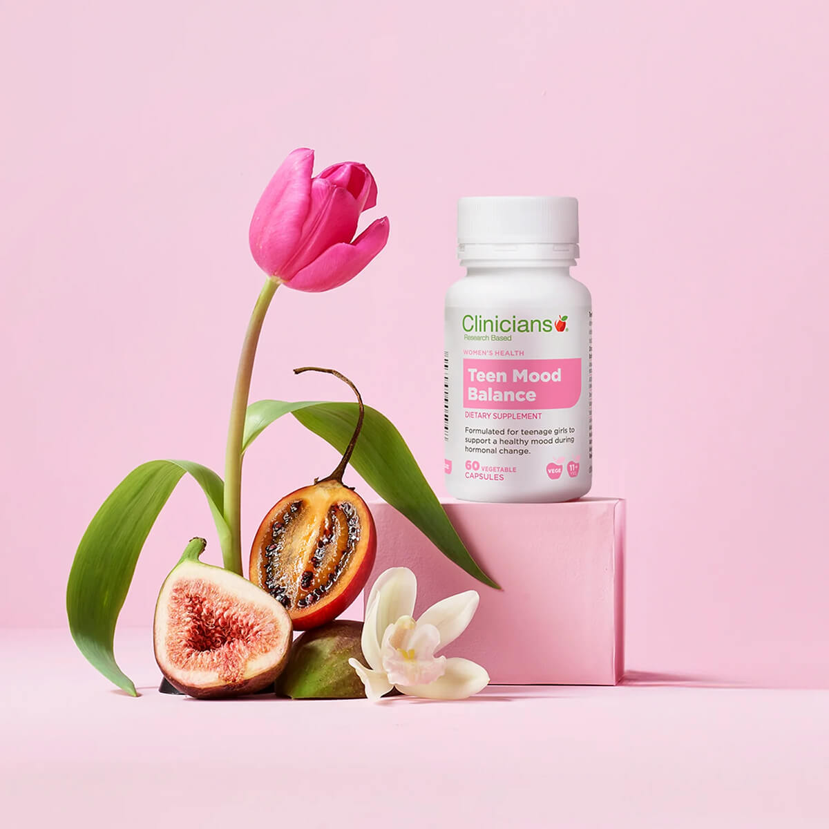 Vitamin bottle labeled 'Clinicians Teen Mood Balance' with a pink tulip and fig on a pink background.