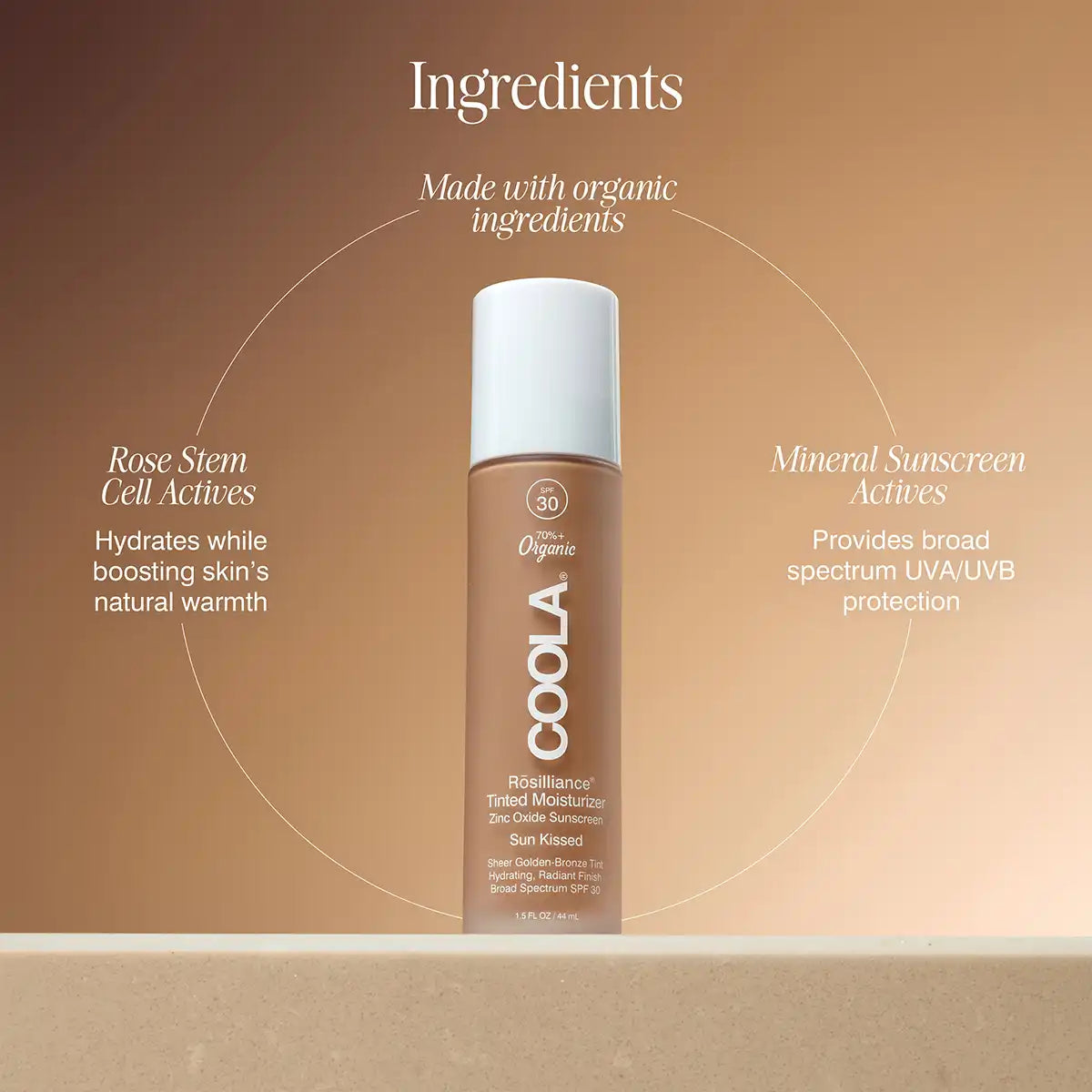 A bottle of COOLA Resilience Tinted Moisturizer centered on a warm beige background with text callouts about organic ingredients, rose stem cell actives, and mineral sunscreen actives.