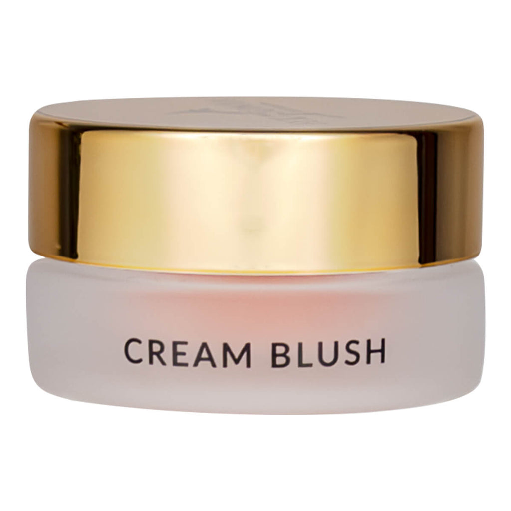 Cream blush jar with gold lid on a white background.