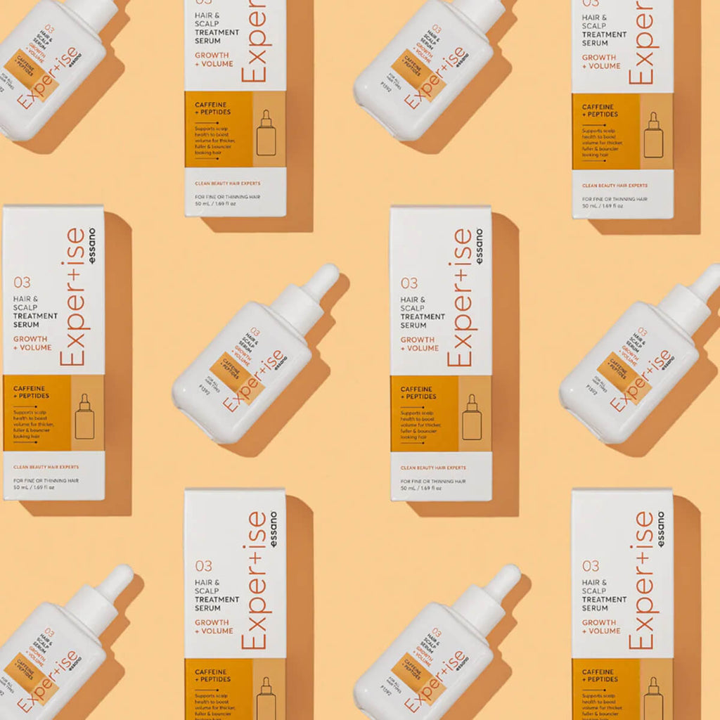 Pattern of 'Expertise' hair care products on a beige background.