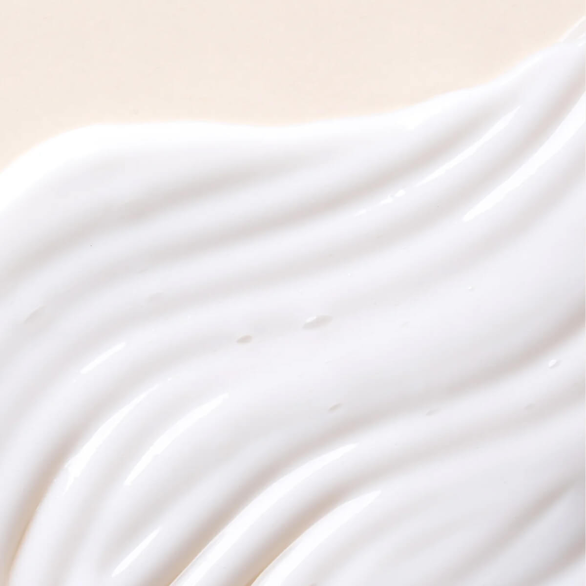 Close-up of smooth white cream texture.