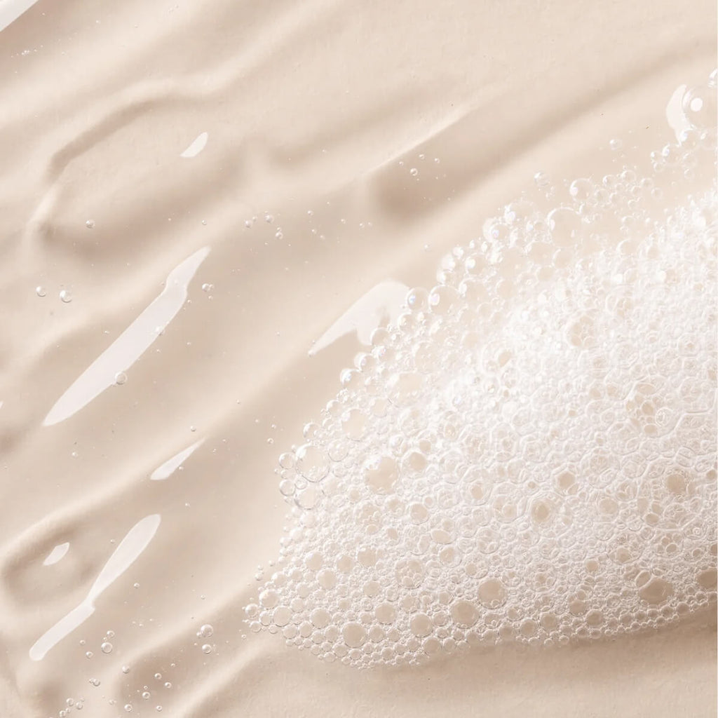 Close-up of a beige liquid with bubbles.