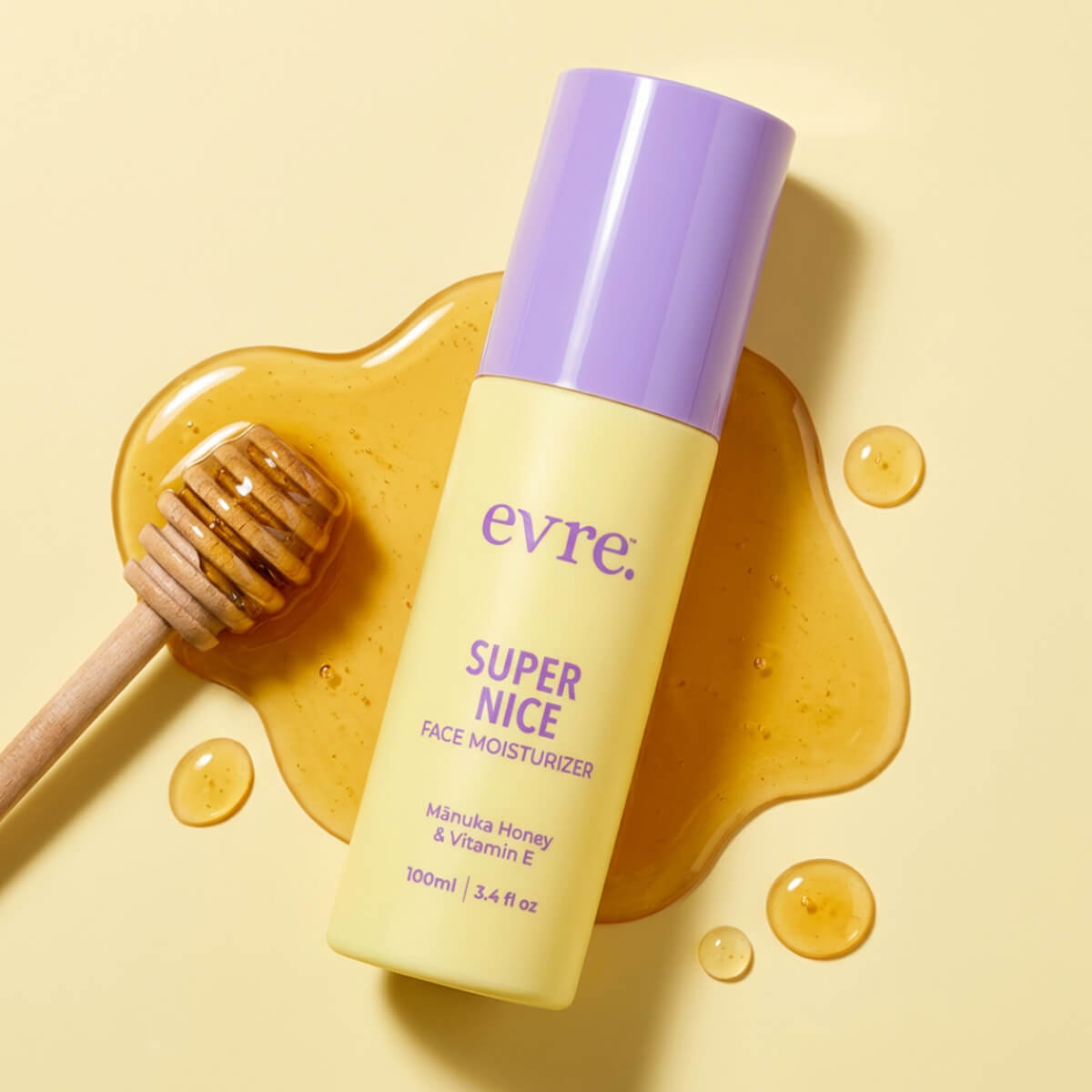 Evre Super Nice face moisturizer bottle with honey and a honeycomb on a yellow background