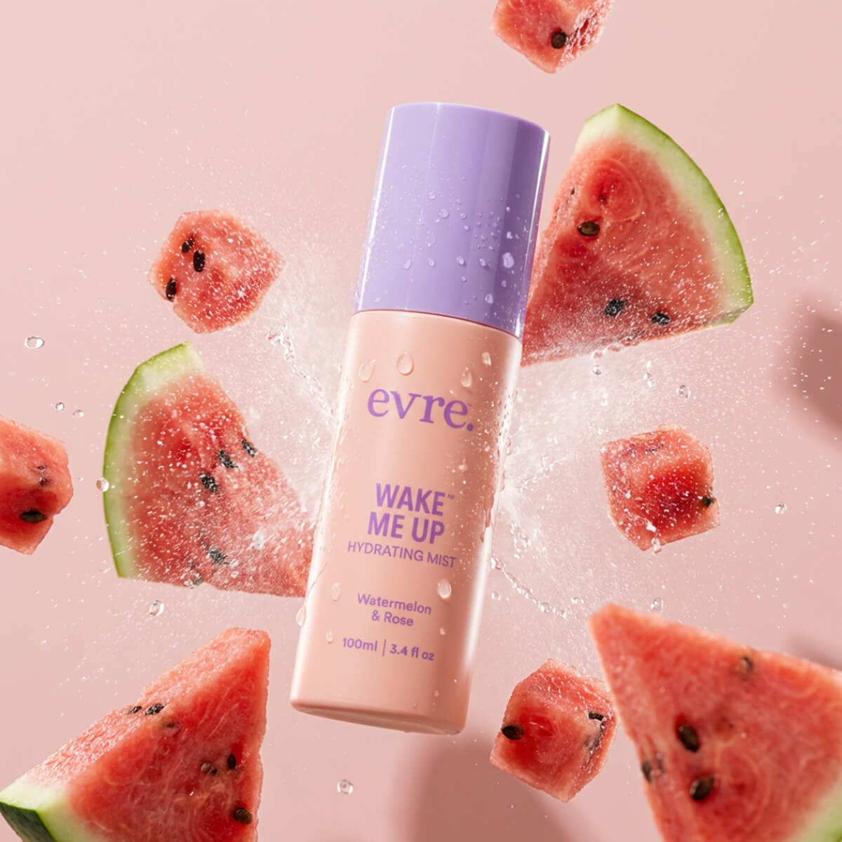 Evre Wake Me Up hydrating mist bottle with watermelon slices on a pink background
