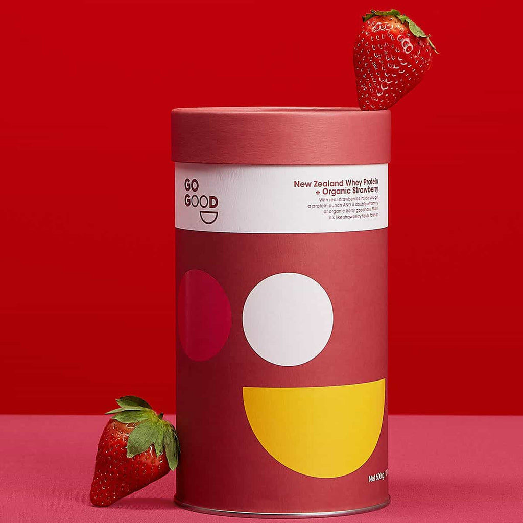 Red container with strawberry on a red background.