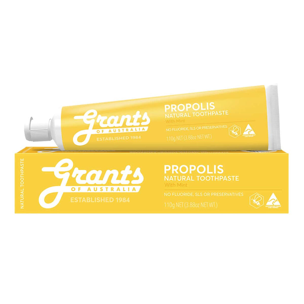 Yellow tube and packaging of Grants Propolis natural toothpaste on a white background.