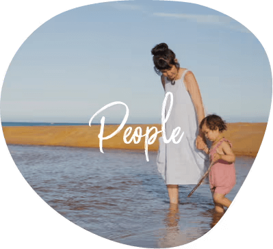 Woman and child walking on a beach with 'People' text overlay