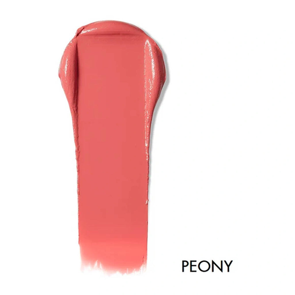 Swatch of lip & cheek cream in the shade 'Peony'. Warm medium pink.