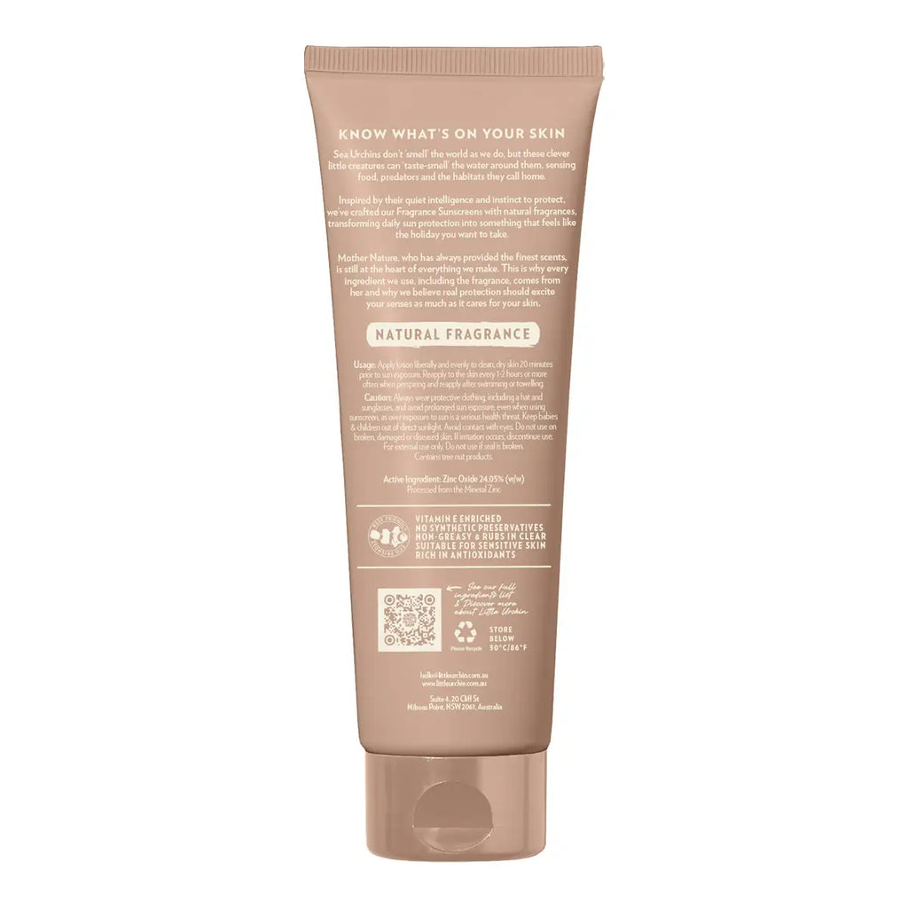 The back of a beige squeeze tube for sunscreen, showing detailed text, a QR code, and a flip-top cap on a solid white background.