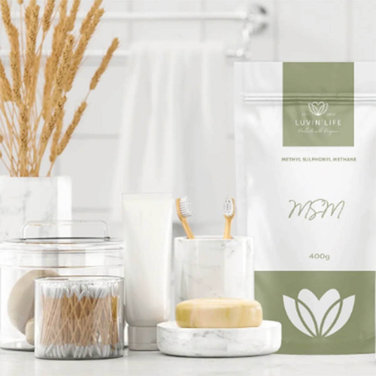 Bathroom setting with toothbrushes, soap, and a package labeled 'LUVIN LIFE' on a white background.