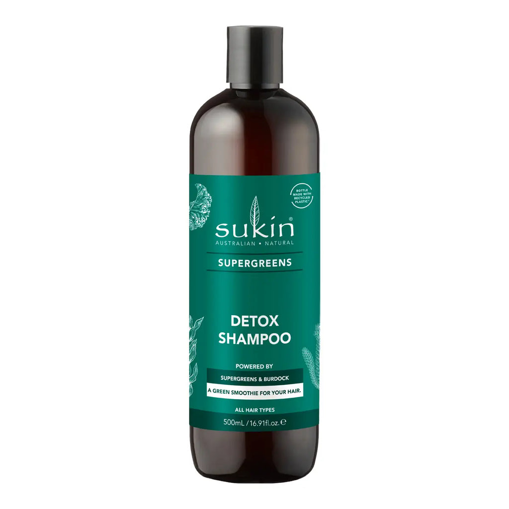A 500ml bottle of Sukin Supergreens Detox Shampoo, featuring a dark amber-brown bottle and a prominent teal green label with white text, set against a plain white background.
