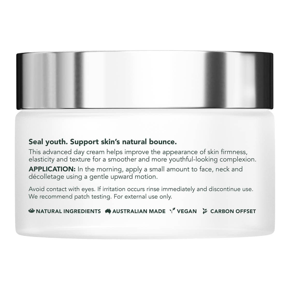 Skincare jar with silver lid on a white background.