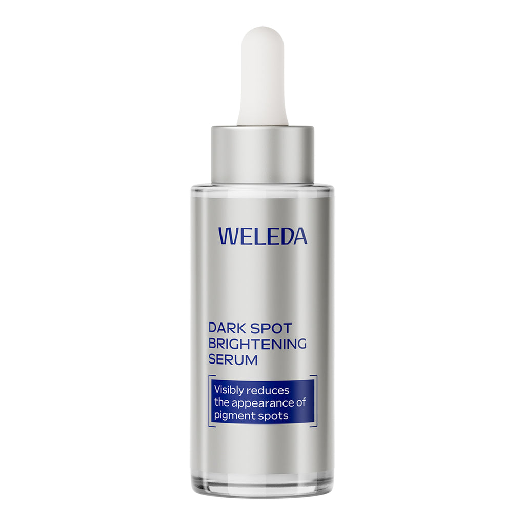 Weleda dark spot brightening serum bottle on a white background.