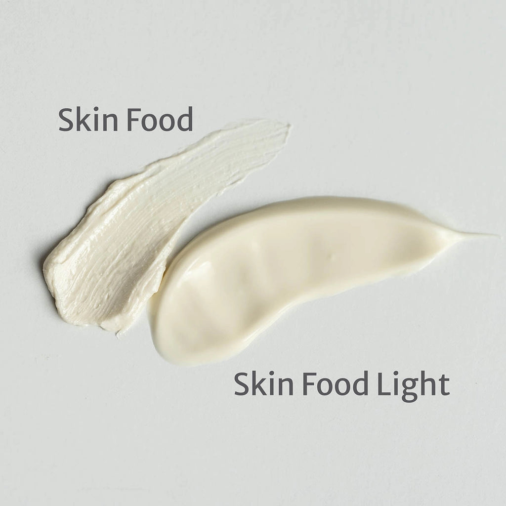 2 swatches showing texture of Weleda Skin Food & Skin Food Light on a grey background.