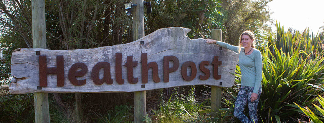 A Woman-Lucy-standing-infront-of-Healthpost-sign