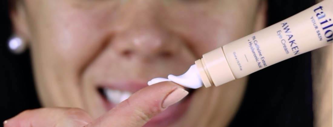 Woman Applies Tailor Skincare Awaken Eye-Cream To Tip of Finger