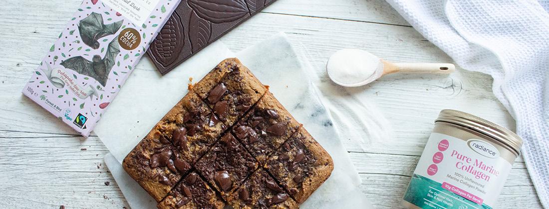 Fresh collagen chickpea brownies placed on table with ingredients