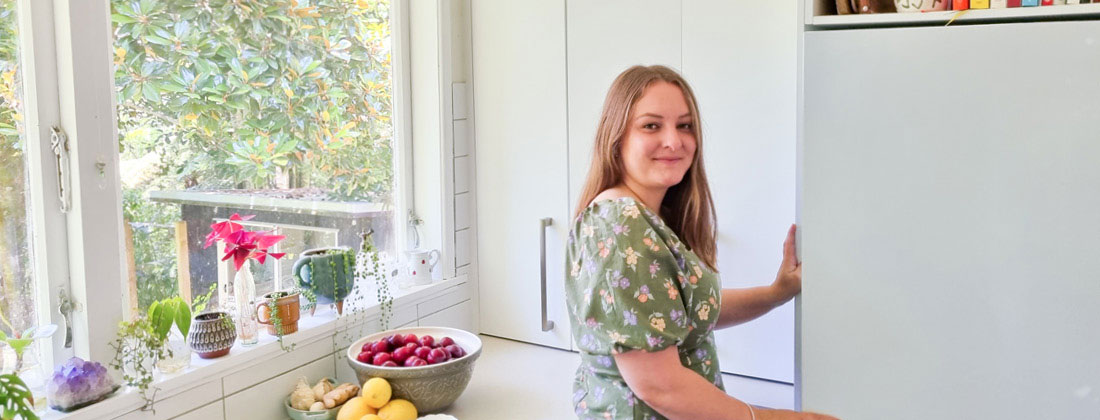 Nutritionist Lena Fischer Smiles At Camera From Her Kitchen