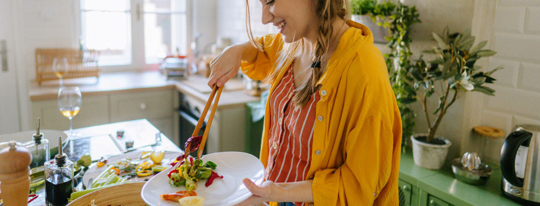 Lifestyle image of a person preparing a meal with wholefoods