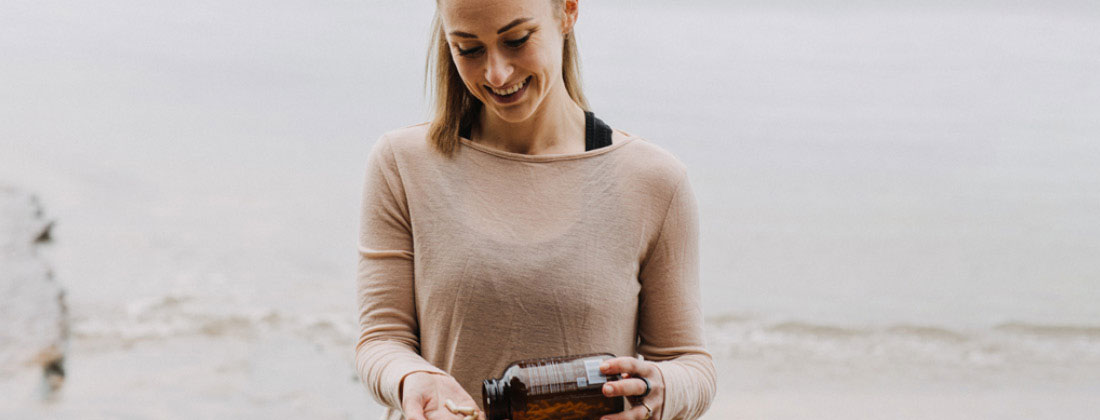 Woman happily holds BePure product