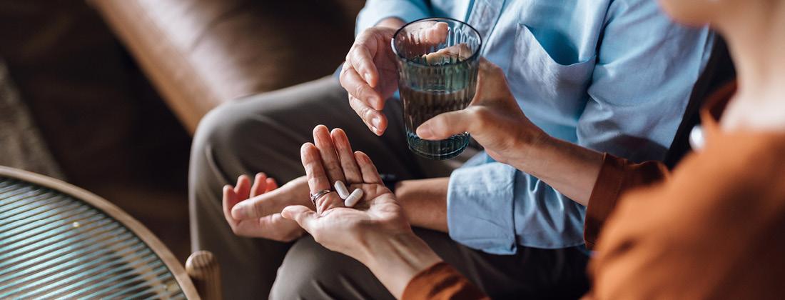 man and woman taking magnesium supplements