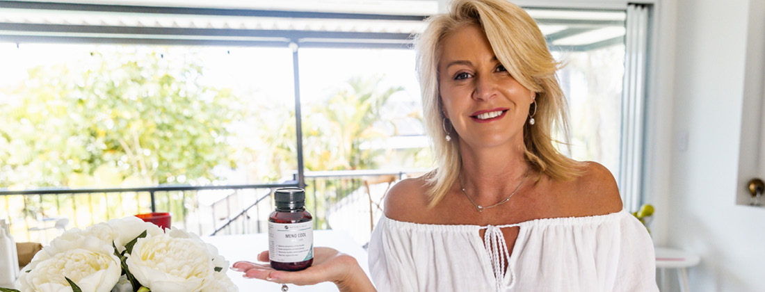 Nature's Help founder Kirsty Stowger holds Meno Cool product sold on HealthPost